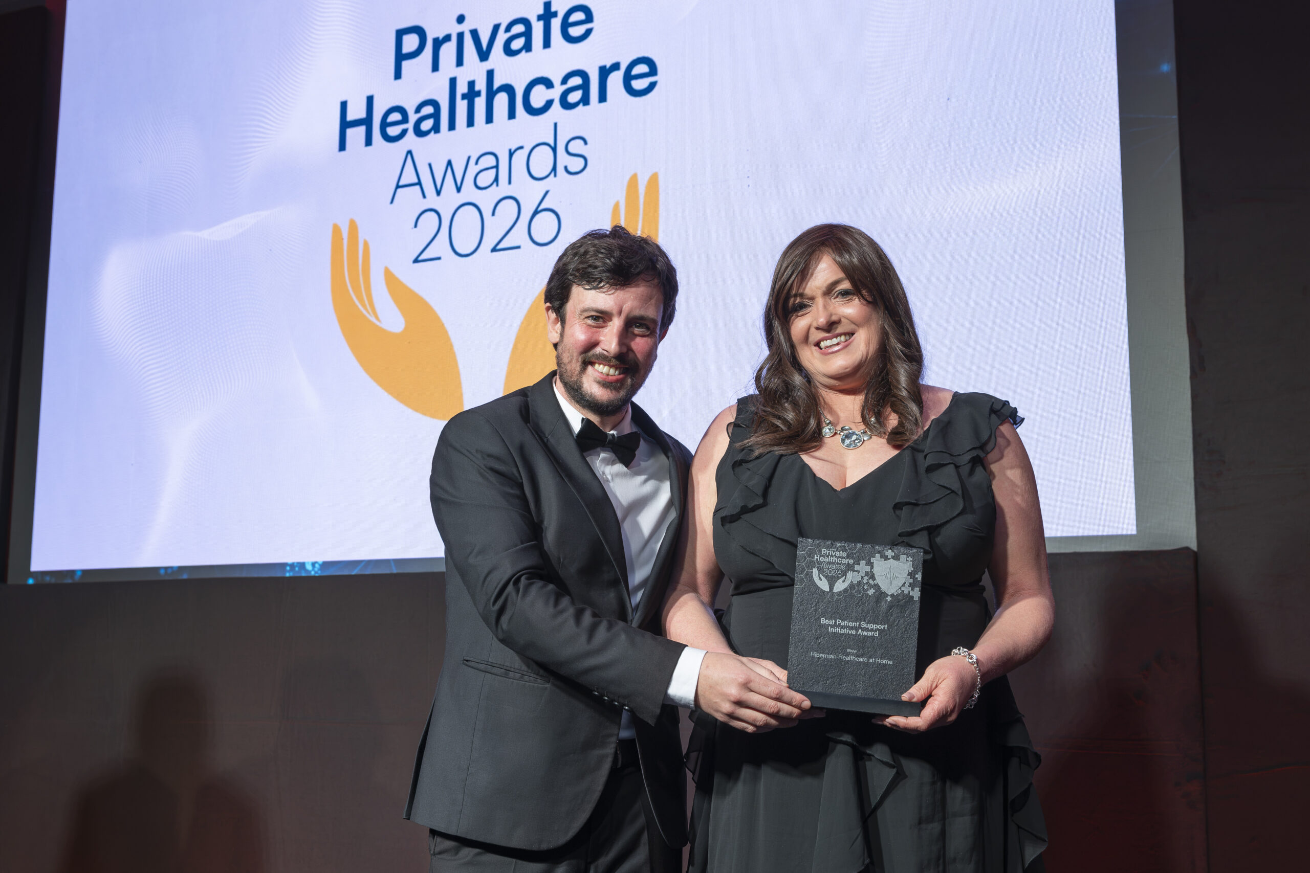 Assistant Director of Nursing Louise Bradley accepting an award for Best Patient Support Initiative